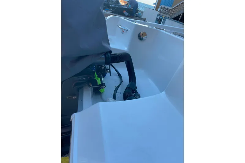 Slide: The Image of 2017 Sea Hunt Triton 210 boat interior with visible engine components. - 21