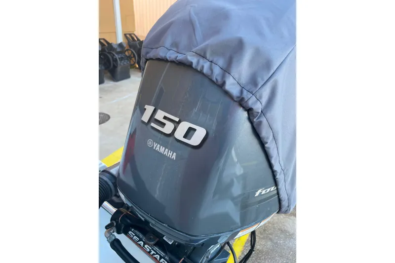 Slide: The Image of Yamaha 150 outboard motor on 2017 Sea Hunt Triton 210 boat, covered and protected. - 22
