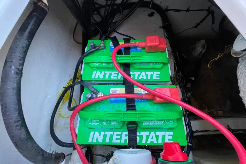 Slide: The Image of Batteries in a 2017 Sea Hunt Triton 210 boat, featuring Interstate brand. - 25