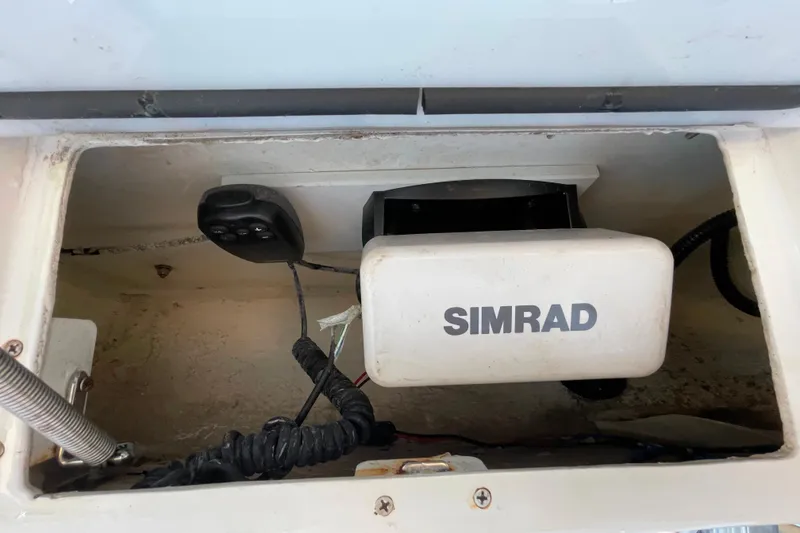 Slide: The Image of Simrad equipment inside a 2017 Sea Hunt Triton 210 boat compartment. - 5