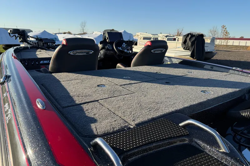 Slide: The Image of 2026 Phoenix 819 ZXL boat interior with seating and control panel, under clear blue sky. - 11