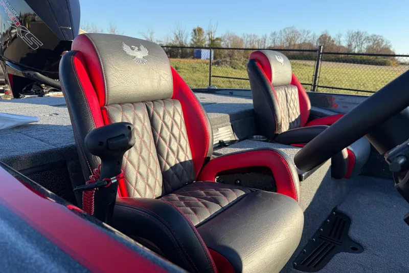 Slide: The Image of 2026 Phoenix 819 ZXL boat interior with red and black leather seats, steering wheel visible. - 13