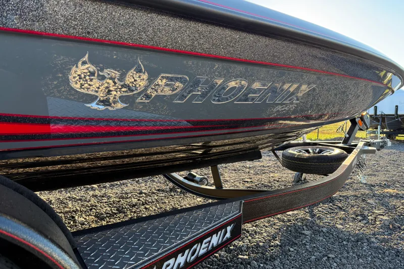 Slide: The Image of 2026 Phoenix 819 ZXL boat on trailer, featuring sleek design and bold logo. - 15