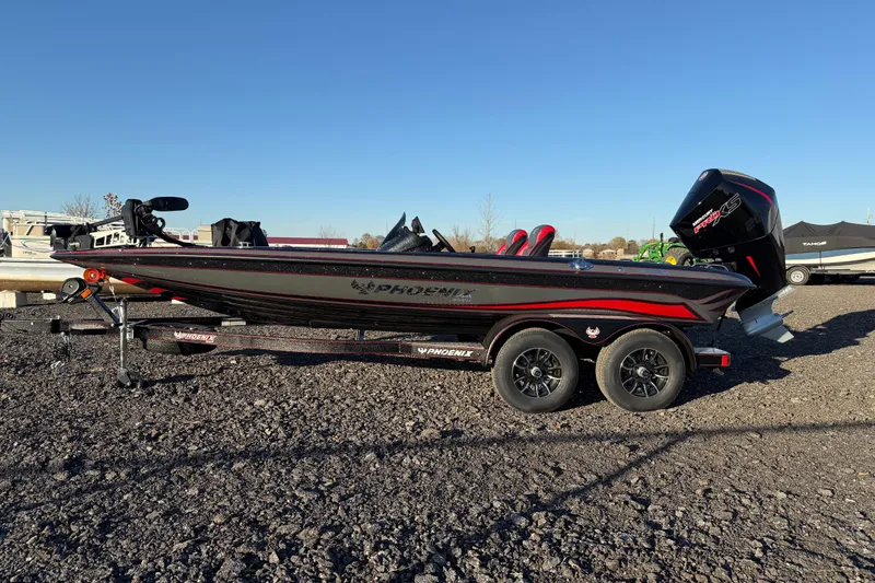 Slide: The Image of 2026 Phoenix 819 ZXL boat on trailer, black and red design, parked outdoors. - 5