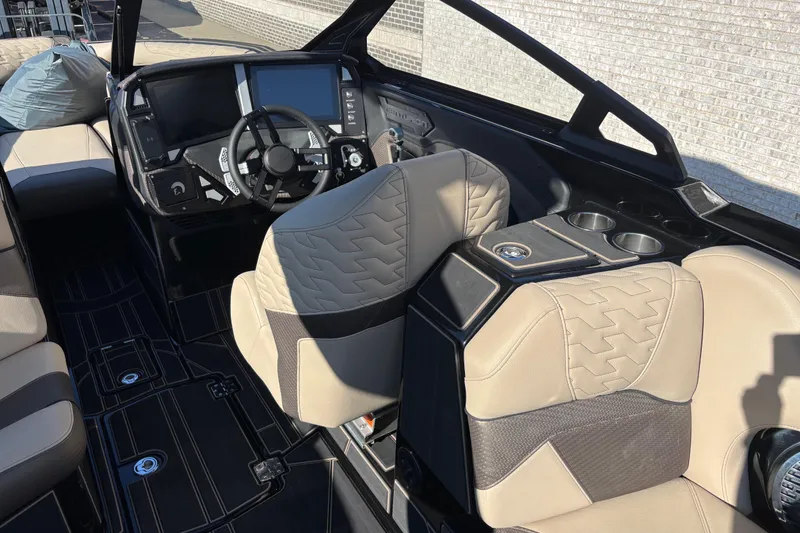 Slide: The Image of 2026 Centurion Ri245 boat interior with modern dashboard and luxurious seating. - 10