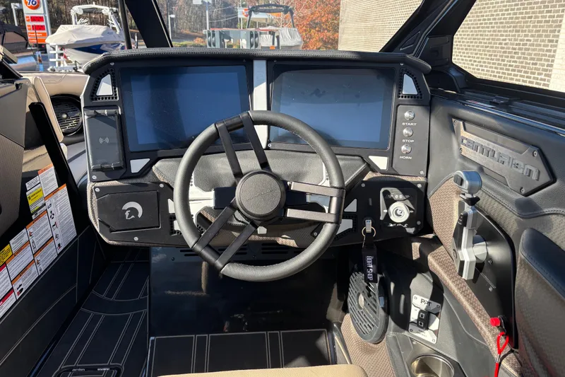 Slide: The Image of 2026 Centurion Ri245 boat dashboard with dual screens and modern controls. - 11