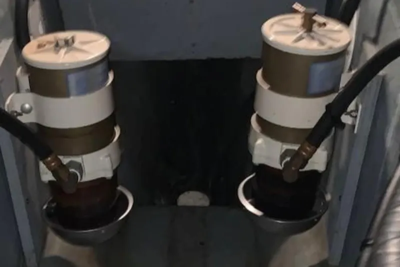 Slide: The Image of Engine room of 1994 Carver 440 Aft Cabin Motor Yacht showing dual fuel filters. - 13