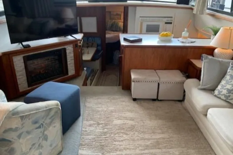Slide: The Image of Interior of 1994 Carver 440 Aft Cabin Motor Yacht with cozy seating and modern decor. - 2