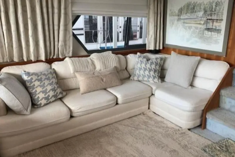Slide: The Image of Luxurious interior of 1994 Carver 440 Aft Cabin Motor Yacht with plush white sofa. - 4