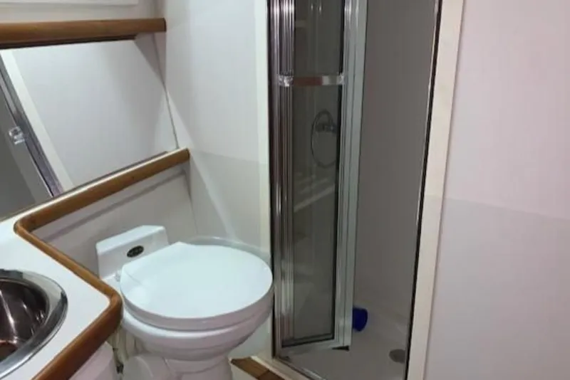 Slide: The Image of Bathroom of 1994 Carver 440 Aft Cabin Motor Yacht with shower and toilet. - 8