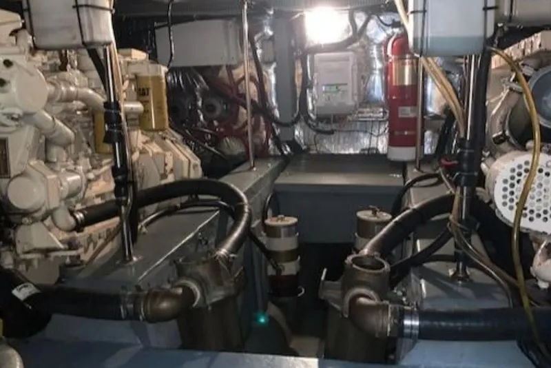 Slide: The Image of Engine room of 1994 Carver 440 Aft Cabin Motor Yacht with visible machinery and equipment. - 11