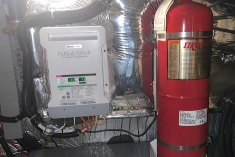 Slide: The Image of Engine room of 1994 Carver 440 Aft Cabin Motor Yacht with fire suppression system. - 12