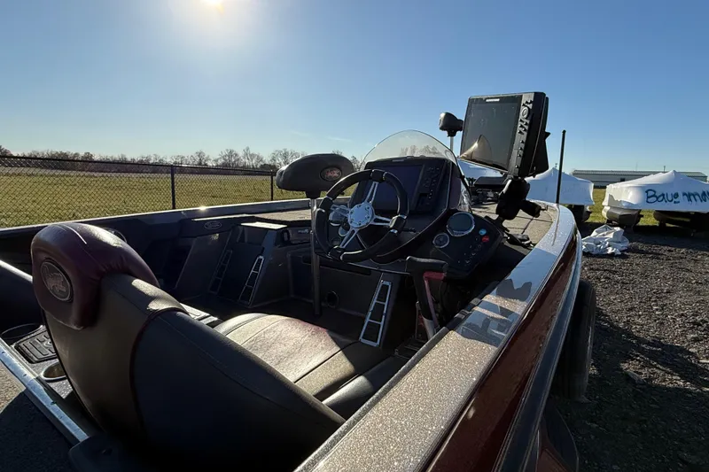 Slide: The Image of 2015 Ranger Z521C Ranger Cup boat interior with steering wheel and control panel. - 11