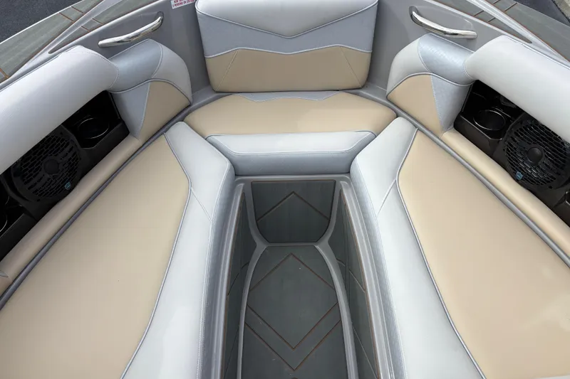 Slide: The Image of Interior of 2026 Supreme S220 boat with beige and gray seating. - 7
