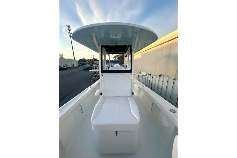 Slide: The Image of 2026 Pair Customs 24 Center Console MV boat with sleek white seating and canopy. - 11
