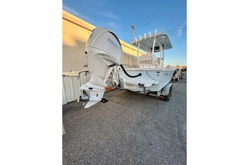 Slide: The Image of 2026 Pair Customs 24 Center Console MV boat with Yamaha outboard motor on trailer. - 18