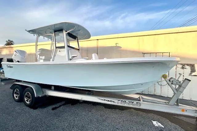 Slide: The Image of 2026 Pair Customs 24 Center Console MV boat on trailer, side view. - 2