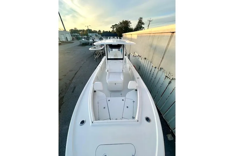 Slide: The Image of 2026 Pair Customs 24 Center Console MV boat, docked, viewed from above. - 8