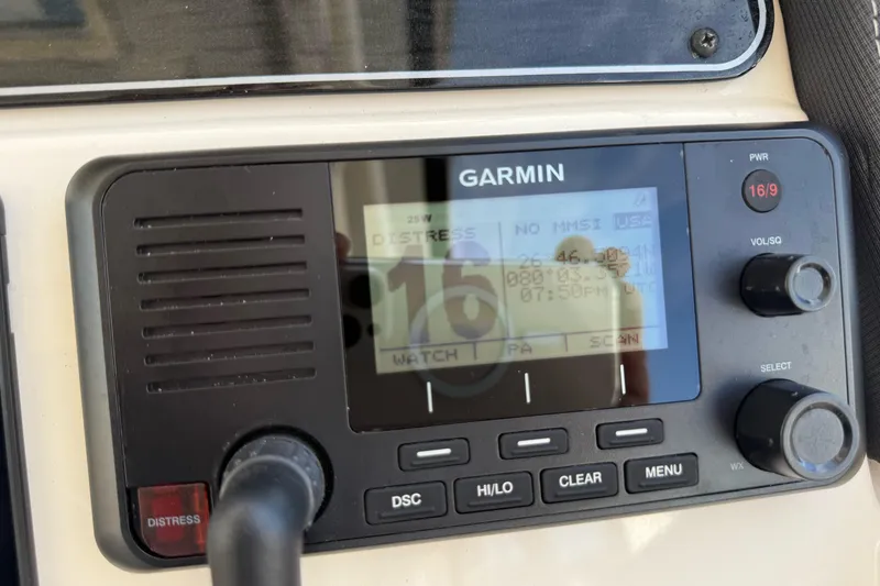 Slide: The Image of Garmin marine radio on 2023 Grady-White Freedom 335 boat dashboard. - 15
