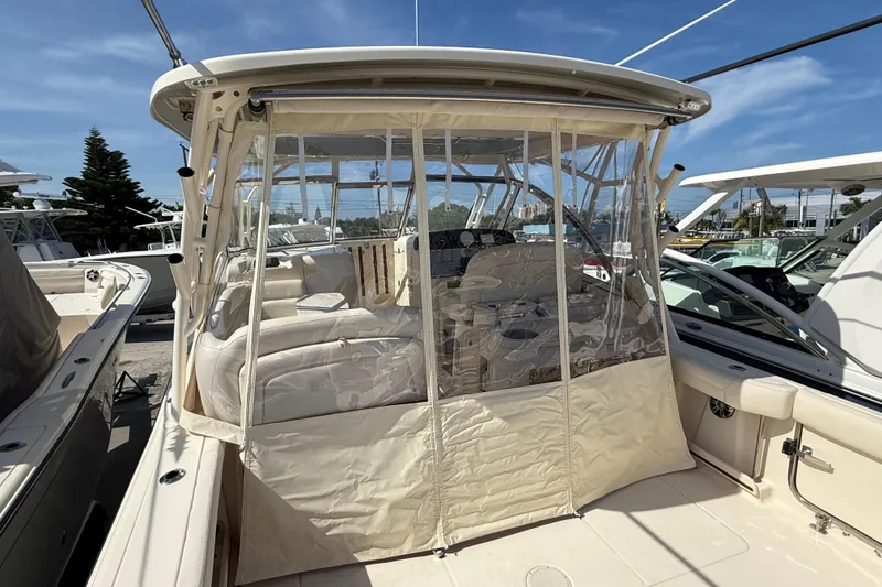 Slide: The Image of 2023 Grady-White Freedom 335 boat with enclosed cockpit and seating area. - 19