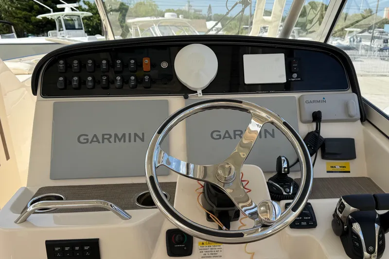 Slide: The Image of 2023 Grady-White Freedom 335 boat dashboard with Garmin navigation system. - 20