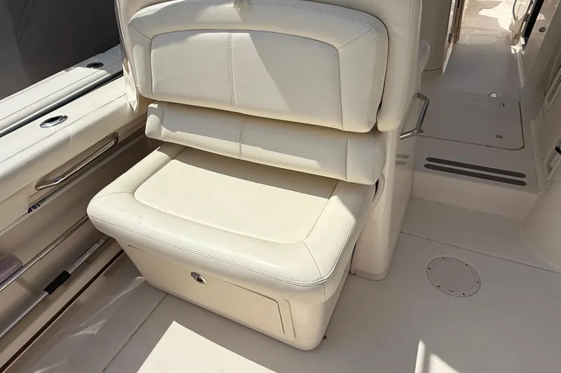 Slide: The Image of 2023 Grady-White Freedom 335 boat interior with cream leather seating. - 30