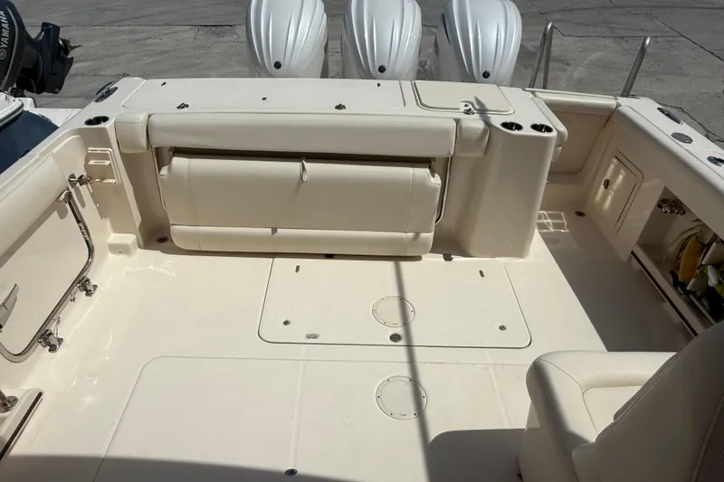 Slide: The Image of 2023 Grady-White Freedom 335 boat interior with seating and Yamaha engines. - 33