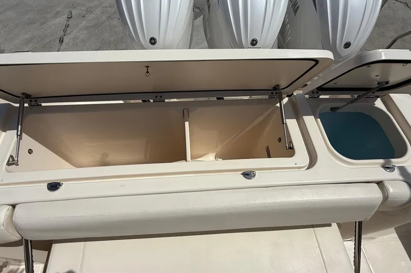 Slide: The Image of 2023 Grady-White Freedom 335 boat storage compartments and livewell. - 35