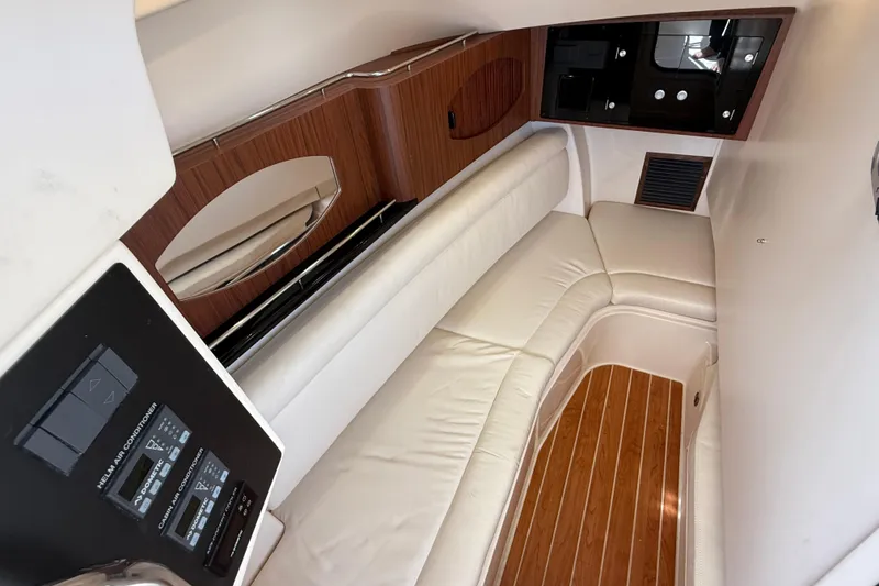Slide: The Image of 2023 Grady-White Freedom 335 cabin interior with leather seating and wood accents. - 38
