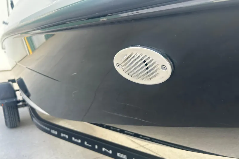 Slide: The Image of 2016 Bayliner Element XL boat hull with a metal vent detail. - 14