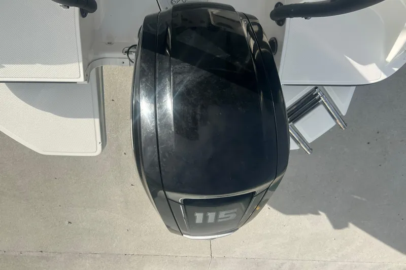 Slide: The Image of 2016 Bayliner Element XL boat with a 115 horsepower outboard motor. - 22