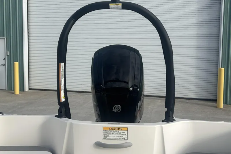 Slide: The Image of 2016 Bayliner Element XL boat with outboard motor in a storage facility. - 23