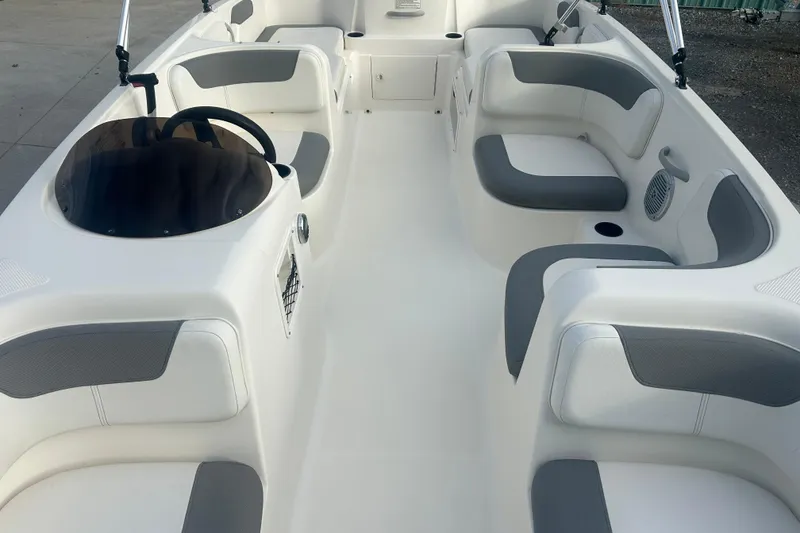 Slide: The Image of 2016 Bayliner Element XL boat interior with gray and white seating. - 26