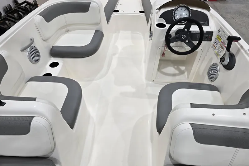 Slide: The Image of 2016 Bayliner Element XL boat interior with gray and white seating and steering console. - 28