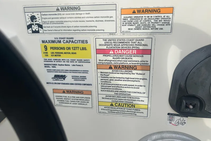 Slide: The Image of 2016 Bayliner Element XL safety and capacity warning labels, detailing maximum load and safety precautions. - 35