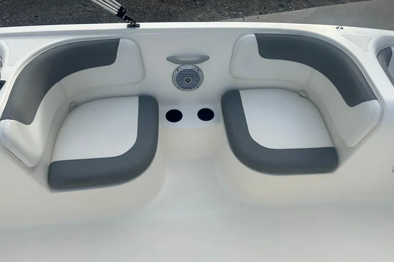 Slide: The Image of 2016 Bayliner Element XL boat interior with gray and white seating. - 38