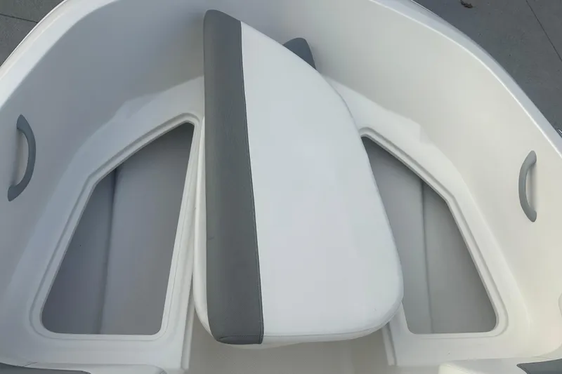 Slide: The Image of 2016 Bayliner Element XL boat interior with white and gray seating. - 45