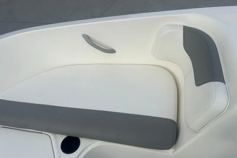 Slide: The Image of 2016 Bayliner Element XL boat seating area with gray and white upholstery. - 47