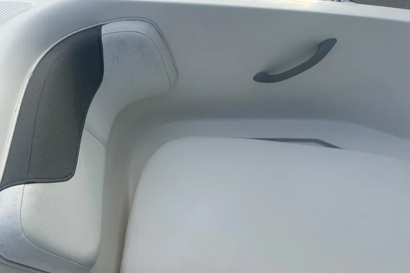 Slide: The Image of 2016 Bayliner Element XL boat interior seating with handle and cushion detail. - 48