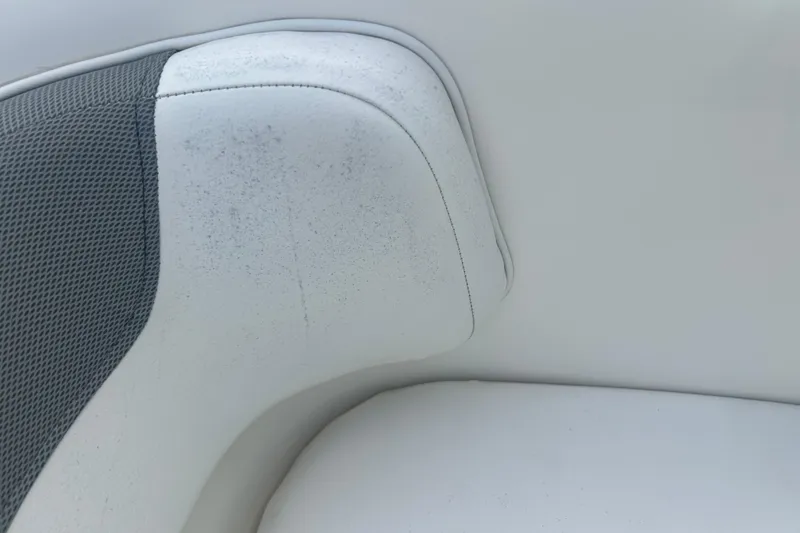 Slide: The Image of 2016 Bayliner Element XL boat seat with white and gray upholstery. - 50