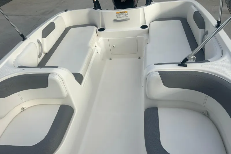 Slide: The Image of 2016 Bayliner Element XL boat interior with white and gray seating. - 51