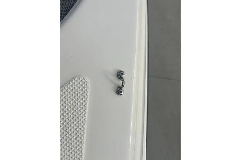 Slide: The Image of Close-up of 2016 Bayliner Element XL boat detail with textured surface and metal fixture. - 56