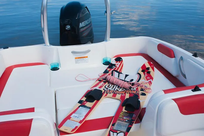 Slide: The Image of 2016 Bayliner Element XL with Mercury 115 outboard motor, featuring swim platform and ladder. - 6