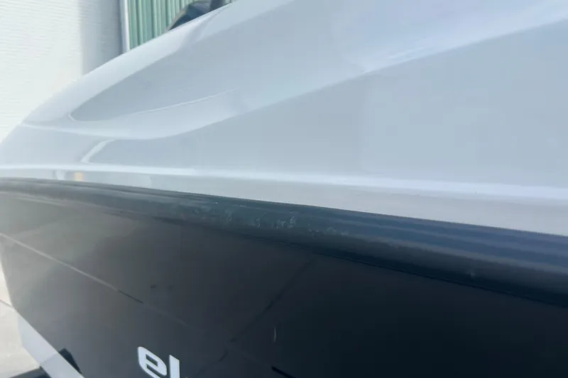 Slide: The Image of 2016 Bayliner Element XL boat side view, showcasing sleek design and branding. - 9