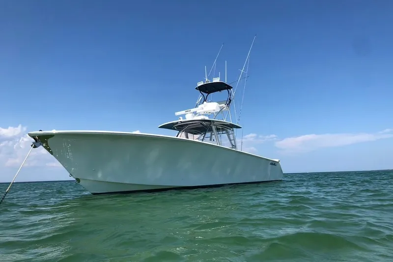 Slide: The Image of 2015 SeaHunter 45 Tournament boat on calm ocean waters under clear blue sky. - 0
