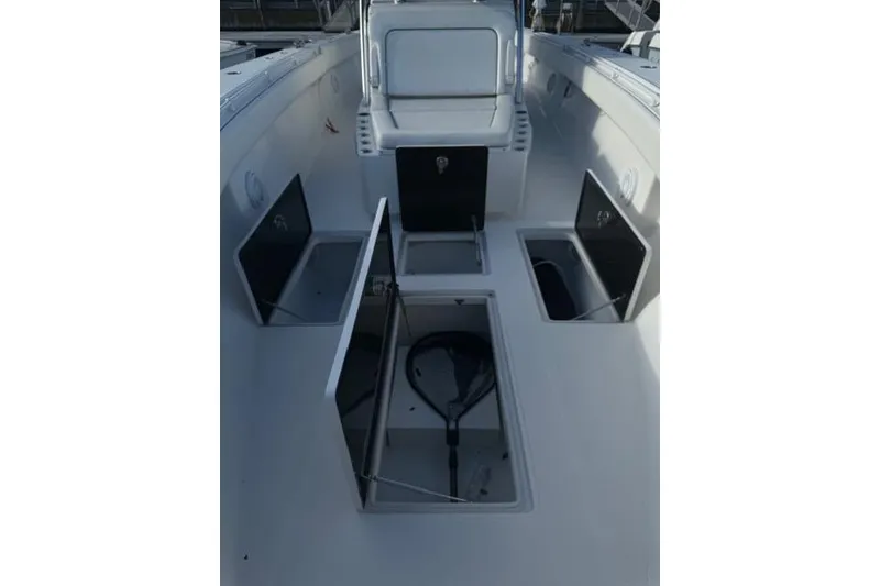 Slide: The Image of 2015 SeaHunter Center Console boat with open storage compartments. - 2