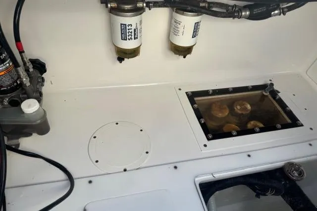 Slide: The Image of 2015 SeaHunter Center Console engine compartment with fuel filters and inspection window. - 7