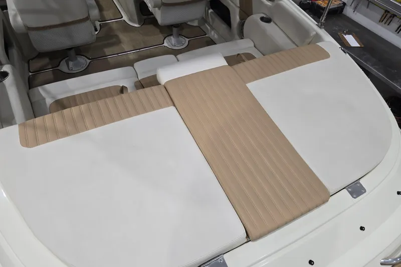 Slide: The Image of Interior of 2014 Larson All American 23 boat with beige and white seating. - 29