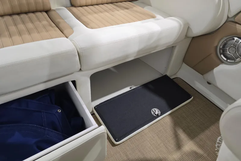 Slide: The Image of Interior of 2014 Larson All American 23 boat with storage compartments and seating. - 30