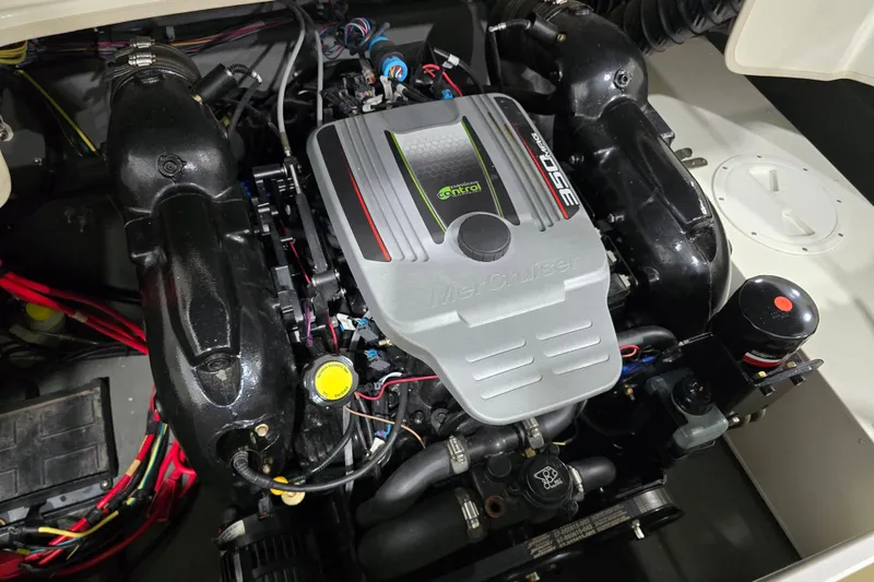 Slide: The Image of Engine of 2014 Larson All American 23 boat, featuring MerCruiser 350 engine. - 31